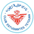 صمم شعار النادي الأول سنة 1976 وكان عبارة عن دائرة تحيط بها عبارة نادي طلبة تطوان بالعربية و"CLUB ESTUDIANTES TETUAN " باللغة الإسبانية وتعني هذه العبارة بالكامل اسم النادي. يتوسط هذا الاسم شعار النادي الذي صمم آنذاك باحترافية لما يحتويه من دلالات توحي إلى اسم النادي الذي تم اختصاره في نادي طلبة تطوان