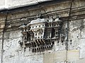 One of the stone-carved birdhouses attached to the outside of the mosque