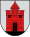 A coat of arms depicting a red castle with black double doors, two black windows, and one central tower all standing on black ground