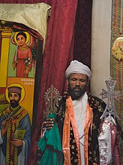 Priest with processional crosses at St. Mary's