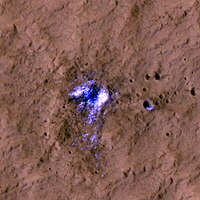 Ice in a fresh Martian impact crater