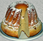 Gugelhupf consists of a soft yeast dough which contains raisins, almonds and Kirschwasser cherry brandy. Some also contain candied fruits and nuts.