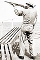 Image 63A merchant seaman aboard a fleet oil tanker practices target shooting with a Remington 870 12 gauge shotgun as part of training to repel pirates in the Strait of Malacca, 1984 (from Piracy)