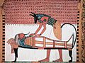 Image 88Anubis, the god associated with mummification and burial rituals, attending to a mummy (from Ancient Egypt)