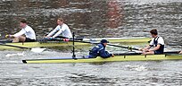 Oxford (foreground) and Cambridge, with their opposing blades coming close to clashing