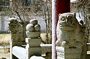 Stone lions and beasts protect the temple