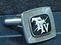 First version of TTV logo on a cufflink for senior executives