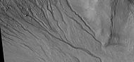 Close-up of gully network showing branched channels and curves; these characteristics suggest creation by a fluid. Note: this is an enlargement of a previous wide view of gullies in a crater, as seen by HiRISE under HiWish program. Location is Eridania quadrangle.