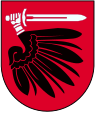 Skrzydło i zbrojna ręka orła Prus Królewskich w herbie powiatu wąbrzeskiego