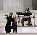 Usher performing with Shakira and Stevie Wonder