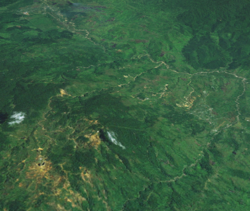 A satellite image of Wau and its mines, looking towards Bulolo