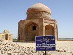 Ruins of an octagonal building crowned by a cupola.