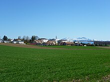 Cheseaux-Sur-Lausanne with Alps in background.JPG