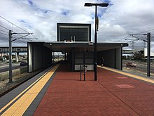 Brick island platform with steel shelter