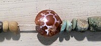 Etched carnelian bead, Egypt Ptolemaic Period, London, Petrie Museum of Egyptian Archaeology UC51264 (detail)