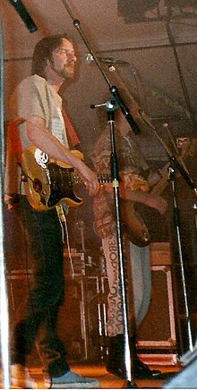 Alan Hull on stage with Lindisfarne in 1991