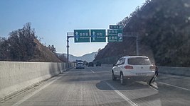 봉현 나들목 1km 표지판(장호원 방면)