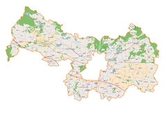 Mapa konturowa powiatu legnickiego, na dole po prawej znajduje się punkt z opisem „Pałac w Janowicach”