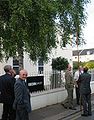 A tree is measured for encroachment over the footway and the roadway