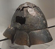 A Boeotian helmet found in the Tigris river, seen from a different angle showing damage.