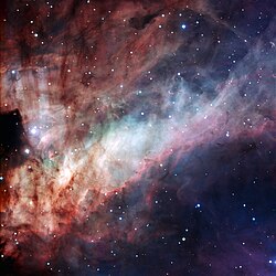 Three-colour composite image of the Omega Nebula (Messier 17, or NGC 6618). Credit w:ESO