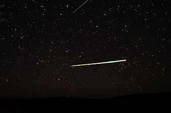 Sporadic bolide over the desert of Central Australia and a Lyrid (top edge)