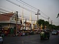 Outside the temple and the passing Thoet Thai Road