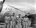 Mexican air force Capt. Radames Gaxiola Andrade stands in front of his P-47D with his maintenance team after he returned from a combat mission