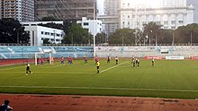 Players on a big-city pitch