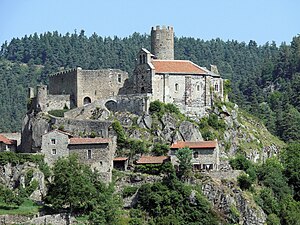 View of the Château de Chalencon to the left and the tower behind the chapel.