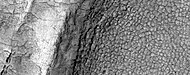 High-center polygons, as seen by HiRISE under HiWish program Image is of the top of a debris apron in Deuteronilus Mensae.