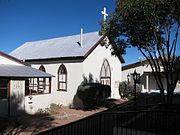 1882 church, now the parish hall, behind