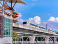 Kualanamu Airport Rail Link train departing from Medan Station via elevated route