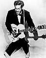 Image 19The 1950s were the true birth of the rock and roll music genre, led by figures such as Chuck Berry (pictured), Elvis Presley, Buddy Holly, Jerry Lee Lewis and others. (from 1950s)