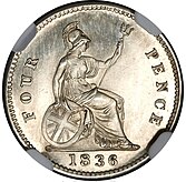 Silver coin with a design featuring a seated, armored woman