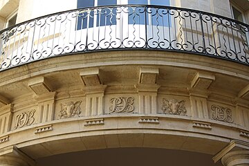 The courtyard balcony with the monogram PCHB, standing for Pierre, Catherine-Henriette, Beauvais