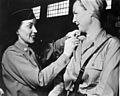 Lt. Rosemary Hogan gets new bars from Maj. Juanita Redmond.