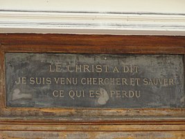 Inscription above the door of the former church.