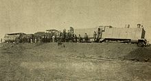 Photo of an armoured CGR 3rd Class 4-4-0 1889 locomotive derailed on ngày 12 tháng 10 năm 1899 during the first engagement of the Second Boer War at Kraaipan