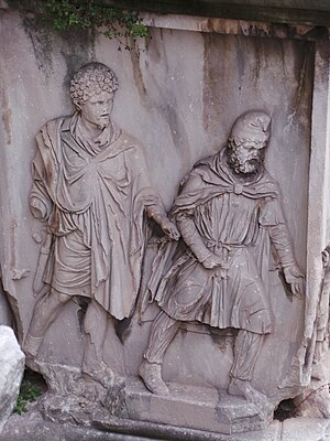 En relief som visar en romersk soldat med en persisk krigsfånge.