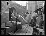 Showing cases of kauri gum being loaded on to a dray, taken July 1905.