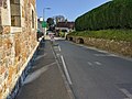 The main road through the village. The village has a large number of calming chicanes.