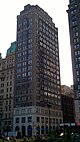 32 Court Street, a high-rise clad in brown brick, viewed from street level