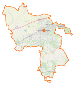 Mapa konturowa powiatu grodziskiego, blisko centrum u góry znajduje się punkt z opisem „Grodzisk Mazowiecki”