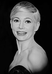 A sepia tone picture of Michelle Williams posing for the camera