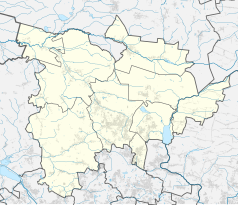 Mapa konturowa powiatu tarnogórskiego, blisko centrum na dole znajduje się punkt z opisem „Dom Gwarka”
