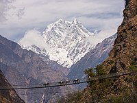 A peak in the Nilgiri mountains backdrops this shot of a simple suspension bridge over the Gandaki River in Nepal. Photo by Faj2323