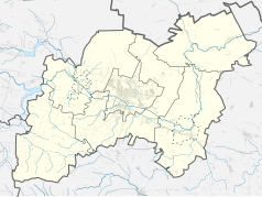Mapa konturowa powiatu ostrowieckiego, blisko centrum na lewo znajduje się punkt z opisem „Kunów”