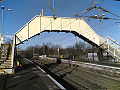 Footbridge over a railway line, at a railway station in Glasgow