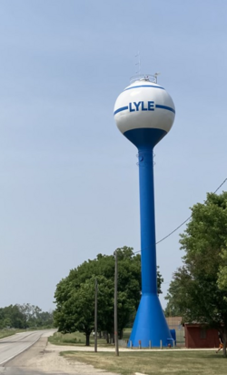 Lyle water tower in park on U.S. Route 218